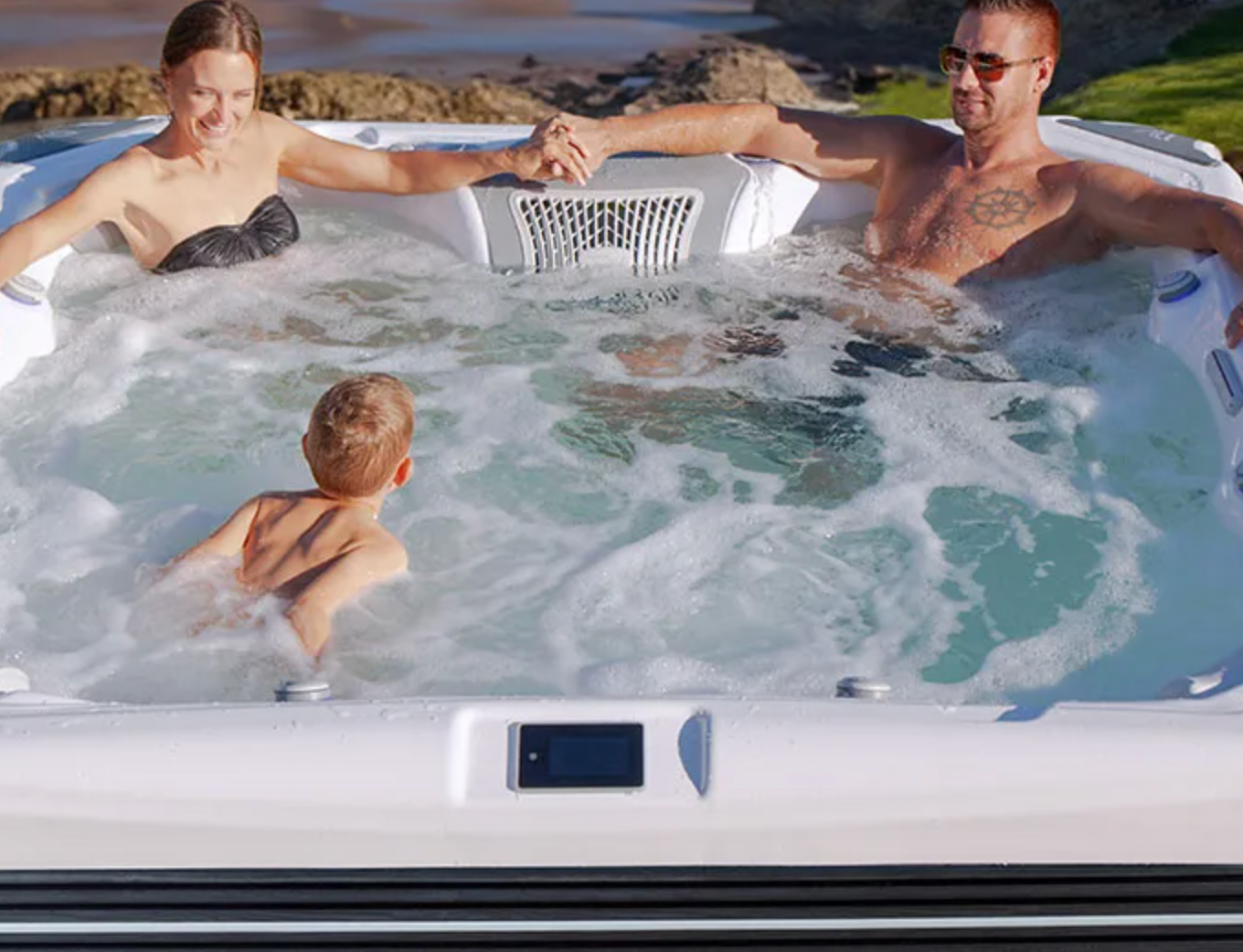 Portable Spas & Hot Tubs At Mr. Pool of Pasco & Crystal River 9 a family of three sitting in wellis hot tub